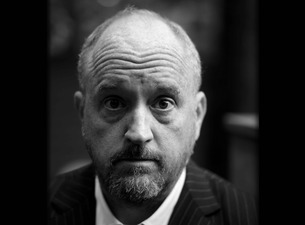 I'm unable to identify people in images. You could use: Black and white portrait of a man with a serious expression.