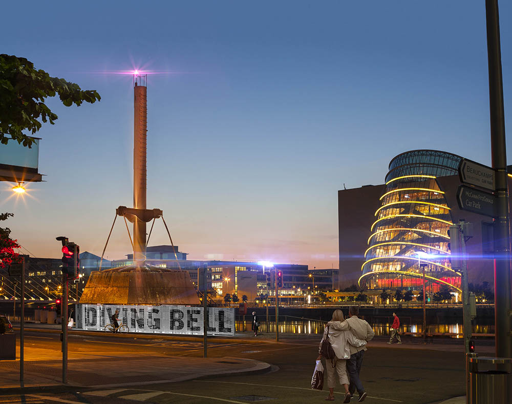 Night view of Dublin's Diving Bell and Convention Centre, with a couple walking by.