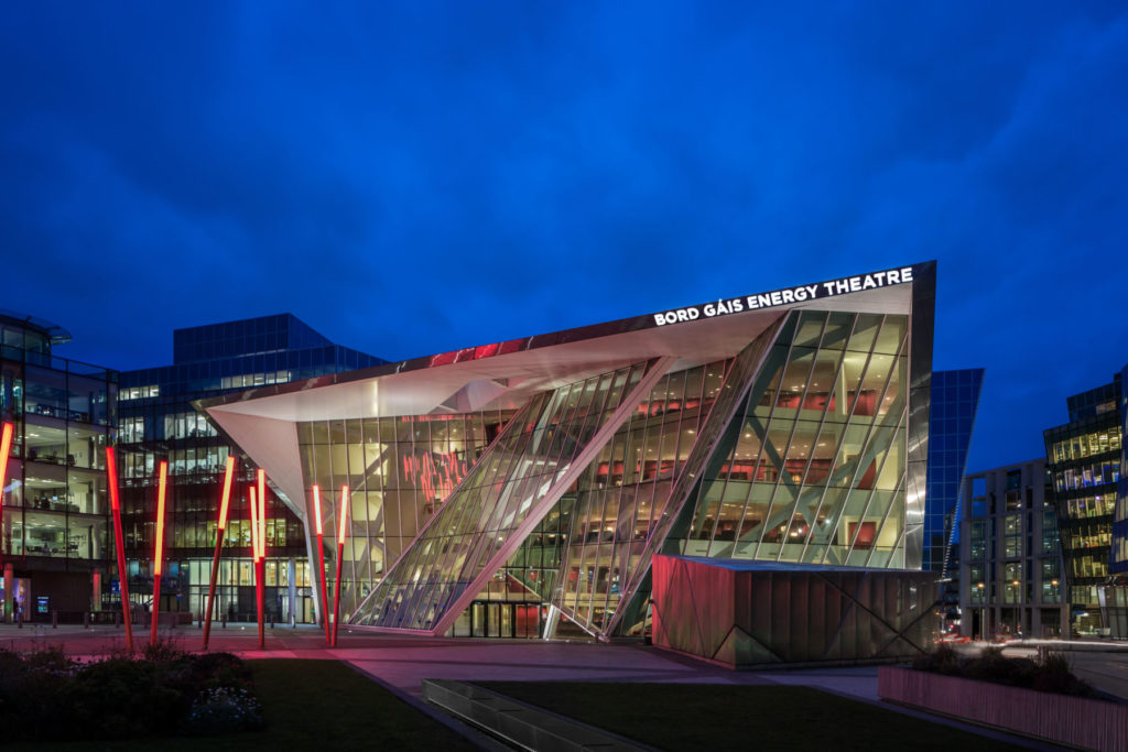 Exterior of Bord Gáis Energy Theatre illuminated at night, modern architecture, Dublin, Ireland.